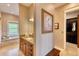 Elegant bathroom with soaking tub, walk-in shower, and and vanities at 5236 Bear Mountain Dr, Evergreen, CO 80439