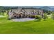 Luxury home with a large yard and mountain views at 5236 Bear Mountain Dr, Evergreen, CO 80439