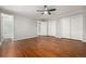 Hardwood floor bedroom with access to bathroom and closets at 6996 S Cook Way, Centennial, CO 80122