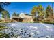 Brick house exterior with a covered patio and yard at 6996 S Cook Way, Centennial, CO 80122