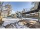 View of backyard with detached garage and carport at 2360 S Franklin St, Denver, CO 80210