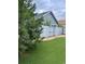 Backyard with artificial turf and a view of a detached structure at 2213 S Kingston Ct, Aurora, CO 80014