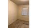 Small bedroom with beige walls and carpet at 2213 S Kingston Ct, Aurora, CO 80014