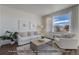 Cozy living room with white couch and large windows at 2672 W 68Th Ave, Denver, CO 80221