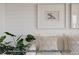 Living room with white shiplap accent wall and neutral decor at 2672 W 68Th Ave, Denver, CO 80221