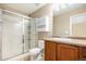 Bathroom with shower/tub combo, vanity, and linen cabinet at 148 N Irvington St, Aurora, CO 80018
