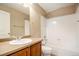Clean bathroom with tub, shower, and vanity with wood cabinets at 148 N Irvington St, Aurora, CO 80018