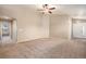 Spacious living room with high ceilings and neutral carpeting at 148 N Irvington St, Aurora, CO 80018