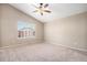 Bright bedroom with carpeted floor, ceiling fan, and window with blinds at 148 N Irvington St, Aurora, CO 80018