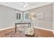 Home office with hardwood floors, a desk, and ample natural light at 2349 W Fair Ave, Littleton, CO 80120