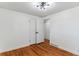 Simple bedroom with hardwood floors and double closets at 4195 S Lipan St, Englewood, CO 80110