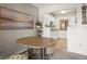 Dining area with a round table and chairs, kitchen view at 1111 Elysian Field Dr # D, Lafayette, CO 80026