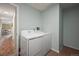 Small laundry room with washer, dryer, and storage at 1111 Elysian Field Dr # D, Lafayette, CO 80026