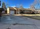 Ranch style home with attached garage and large yard at 6655 S Williams Cir, Centennial, CO 80121