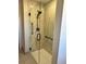 Walk-in shower with glass enclosure and marble tile at 6655 S Williams Cir, Centennial, CO 80121