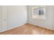 Simple bedroom with hardwood floors and neutral walls at 3626 E 106Th Ave, Thornton, CO 80233