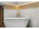 Elegant bathroom featuring a freestanding tub and gold fixtures at 1155 Meadow St, Longmont, CO 80501