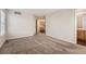 Bright bedroom with carpet flooring and access to bathroom at 20000 E Mitchell Pl # 4, Denver, CO 80249