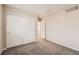 Bright bedroom with double door closet and neutral carpeting at 20000 E Mitchell Pl # 4, Denver, CO 80249