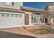 Front view of townhome, showcasing the entryway and garage at 20000 E Mitchell Pl # 4, Denver, CO 80249