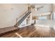 Living area featuring a staircase, hardwood floors, and high ceilings at 20000 E Mitchell Pl # 4, Denver, CO 80249