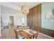 Dining room with wood wall accents and a modern dining set at 1094 Rambling Oak Dr, Monument, CO 80132