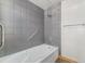 Bathroom with tub and gray tile surround at 1020 15Th St # 202, Denver, CO 80202