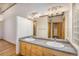 Double vanity bathroom with gray tile and modern lighting at 1020 15Th St # 202, Denver, CO 80202