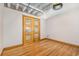 Bedroom with hardwood floors and double doors at 1020 15Th St # 202, Denver, CO 80202