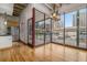 Bright dining area with hardwood floors and access to a balcony with city views at 1020 15Th St # 202, Denver, CO 80202