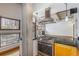 Sleek kitchen featuring granite countertops and stainless steel appliances at 1020 15Th St # 202, Denver, CO 80202