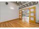 Open living room with hardwood floors and access to a balcony at 1020 15Th St # 202, Denver, CO 80202