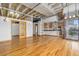 Open living area with hardwood floors, exposed beams, and city views at 1020 15Th St # 202, Denver, CO 80202