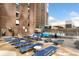 Community rooftop pool with plenty of lounge chairs at 1020 15Th St # 202, Denver, CO 80202
