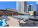 Community rooftop pool with lounge chairs and city views at 1020 15Th St # 202, Denver, CO 80202