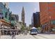 Bustling city street with shops and the iconic Daniels & Fisher Tower at 1020 15Th St # 202, Denver, CO 80202