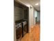 Laundry room with washer, dryer, and shelving at 14602 E 2Nd Ave # 109C, Aurora, CO 80011