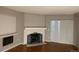 Living room with hardwood floors, fireplace, and sliding door at 14602 E 2Nd Ave # 109C, Aurora, CO 80011