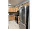 Kitchen with stainless steel appliances and wood cabinets at 14602 E 2Nd Ave # 109C, Aurora, CO 80011