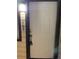 White front door with keypad entry and exterior light fixture at 14602 E 2Nd Ave # 109C, Aurora, CO 80011