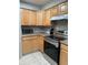 Kitchen with wood cabinets, stainless steel appliances at 14602 E 2Nd Ave # 109C, Aurora, CO 80011