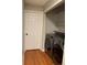 Laundry area with washer, dryer, and storage shelves at 14602 E 2Nd Ave # 109C, Aurora, CO 80011