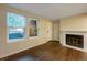Living room with hardwood floors and view of patio at 6705 S Field St # 803, Littleton, CO 80128