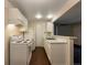 Efficient kitchen with white appliances and ample counter space at 6705 S Field St # 803, Littleton, CO 80128