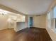 Open living room with kitchen and hardwood floors at 6705 S Field St # 803, Littleton, CO 80128