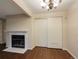Living room featuring a fireplace and double doors at 6705 S Field St # 803, Littleton, CO 80128