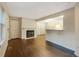 Bright living room with fireplace and hardwood floors at 6705 S Field St # 803, Littleton, CO 80128