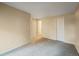 Spacious bedroom with carpet flooring and access to hallway at 6705 S Field St # 803, Littleton, CO 80128