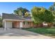 Ranch-style house with attached garage at 1575 S Clermont St, Denver, CO 80222