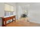 Open concept dining area with hardwood floors and access to kitchen at 1575 S Clermont St, Denver, CO 80222